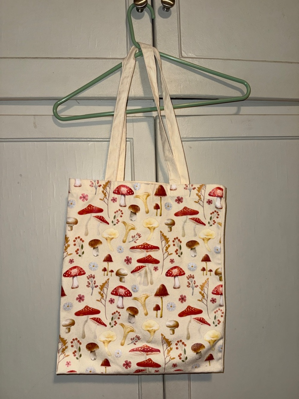 Canvas tote bag with mushroom design.